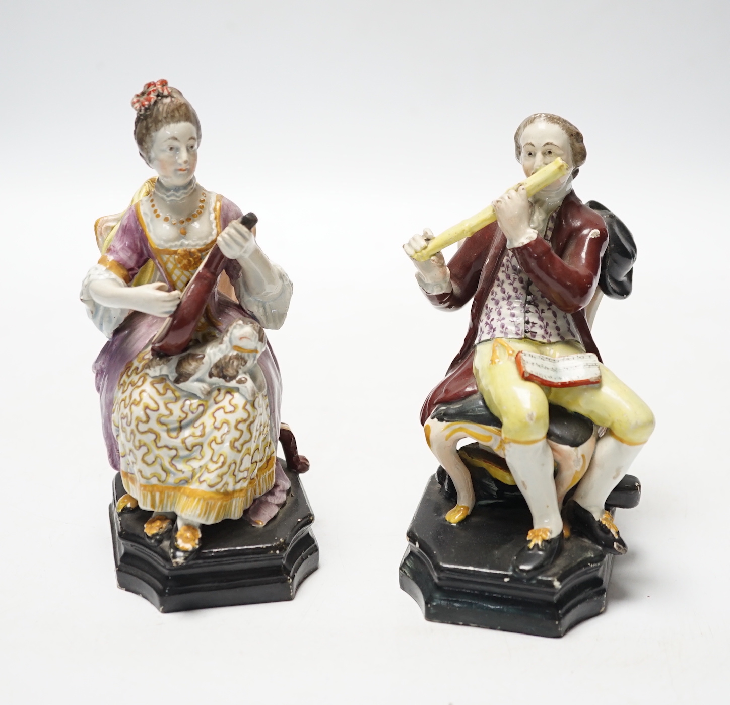 A pair of Staffordshire pearlware figures of musicians seated on chairs, c.1825, 14cm